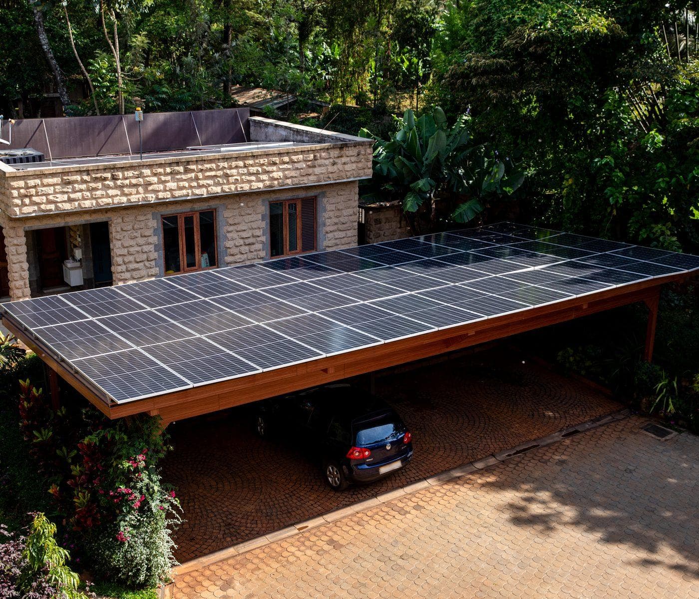 Solar array installed over the carport of a Kenyan home